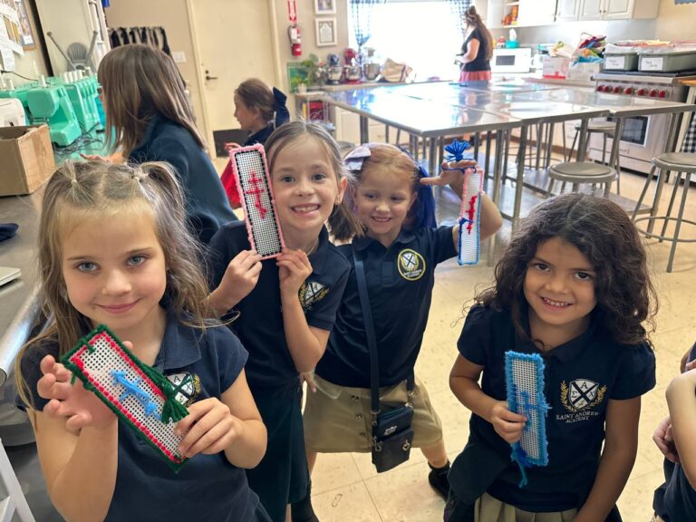1st Graders with their finished sewing project: A bookmark to help them practice their running & whip stitch!